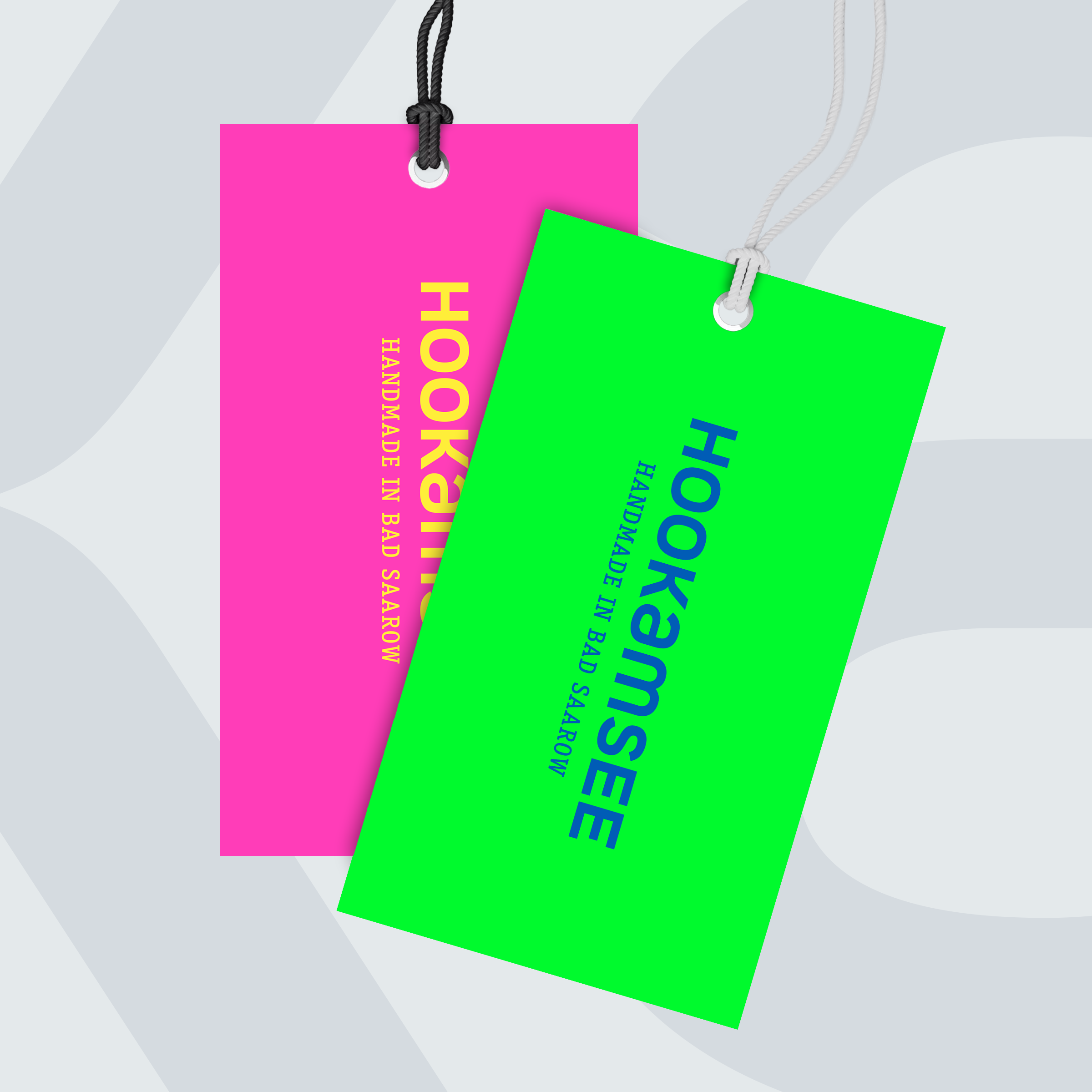 Hangtags in Neonpink und Neongrün mit HOOKamSEE Logo